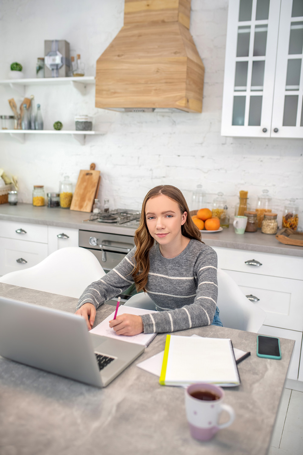 pretty-girl-with-long-hair-sitting-at-the-table-2024-10-18-04-35-45-utc